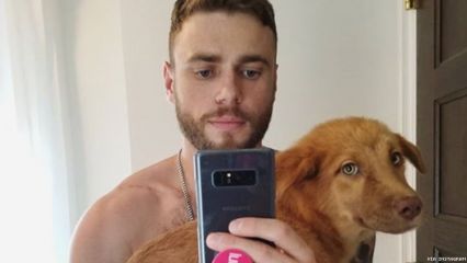 Shirtless with a new puppy